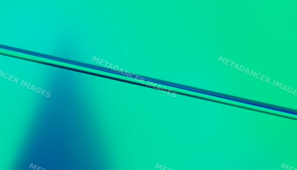 Abstract digital rendering with a diagonal blue line on green gradient