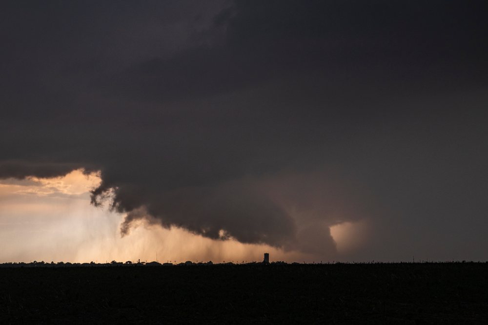Storm cloud with rain shaft and dark thunderstorm clouds over open land at sunset, Storm Chasing, Weather, Environmental issues, Eads, Colorado, USA.