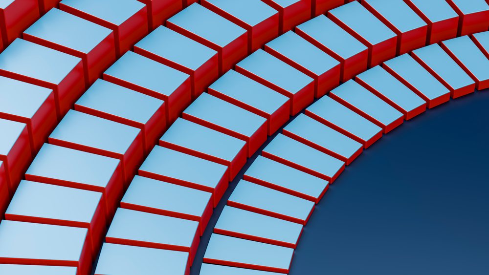 Curved rows of blue-topped red 3D blocks form a repetitive geometric pattern in abstract digital art.