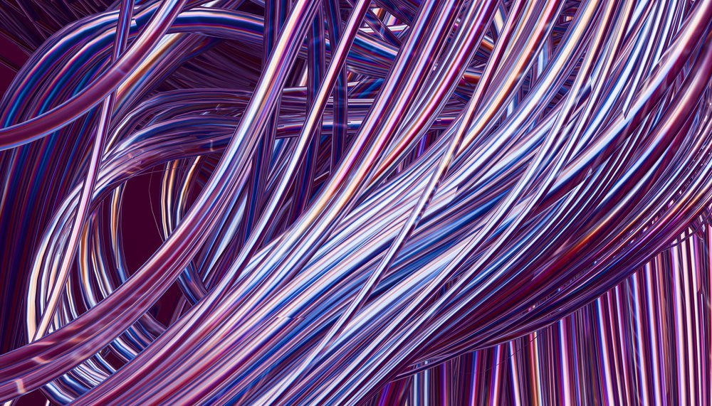 Tangled shiny metallic wires with blue and purple reflections forming an abstract intertwined structure.