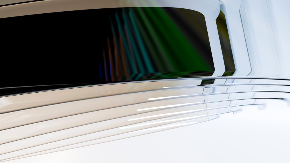 Abstract curved metallic lines with smooth, reflective surfaces show colorful reflections on a white background.