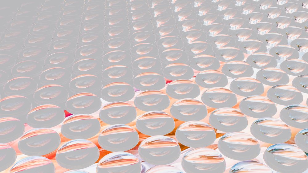 Transparent bubble wrap sheet with inflated air bubbles used as protective packaging in shipping and handling.