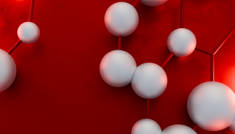 3D rendering of a molecule with white spherical atoms connected by chemical bonds on a red background.