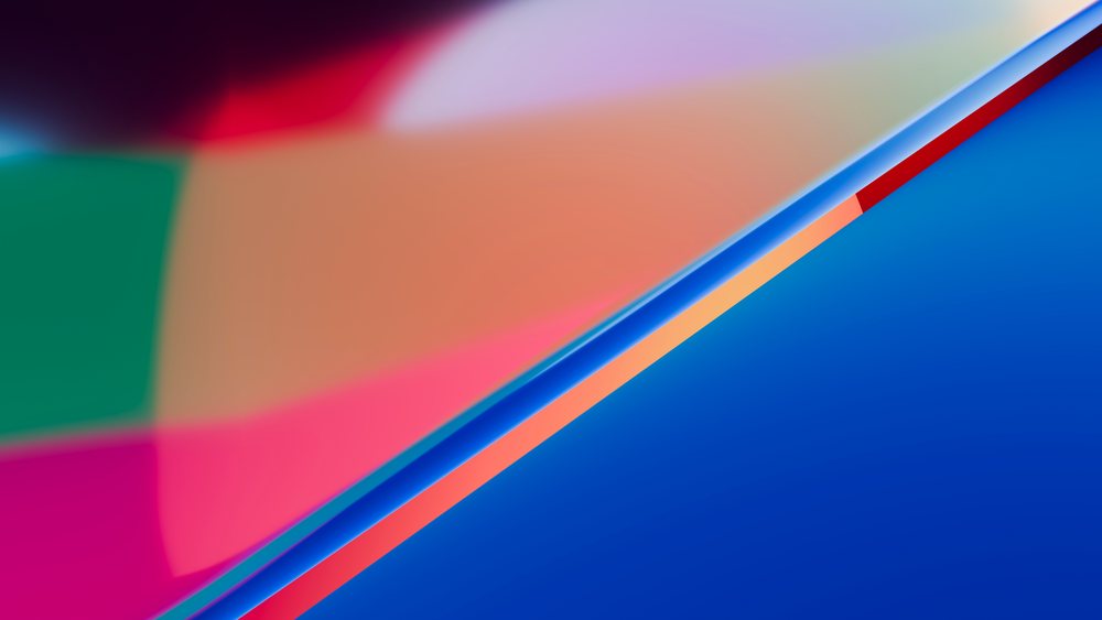 Abstract colorful shapes with soft edges and light reflections create a vibrant modern visual art design.