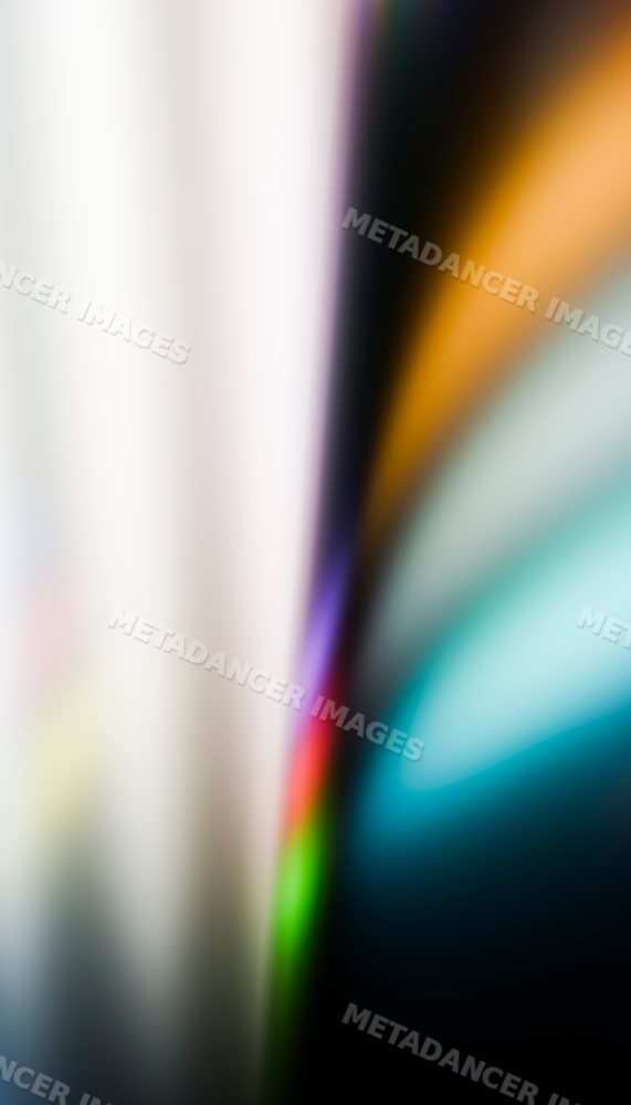 A multicolored abstract background with smooth blurred light