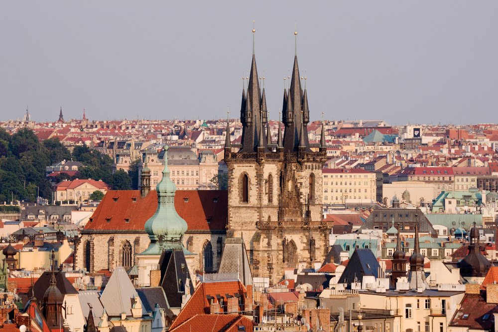 Tyn Church's Gothic spires rise above rooftops's Old Town cityscape, Prague, Czech Republic.