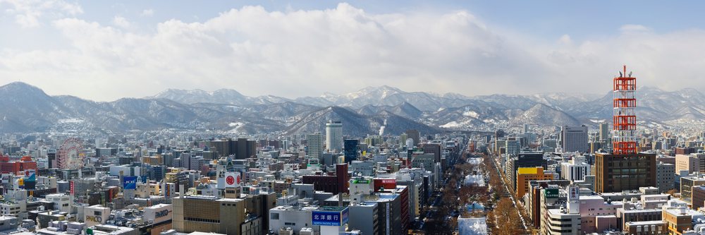 City skyline of sapporo japan with snowy mountains, Hokkaido.