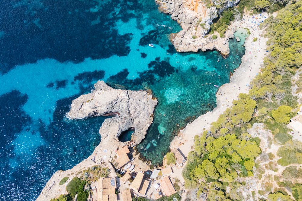 Aerial view of Cala s'Almunia beach and rocky coastline, Landscape, Lifestyle, Mallorca, Spain.