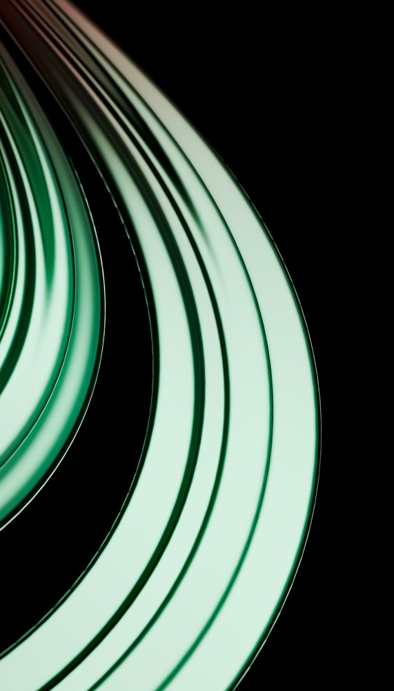 Curved green glass tubes with smooth surfaces and reflections against a black background.