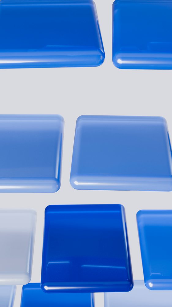 Blue glossy square shapes float against a gray background in an abstract digital 3D illustration.