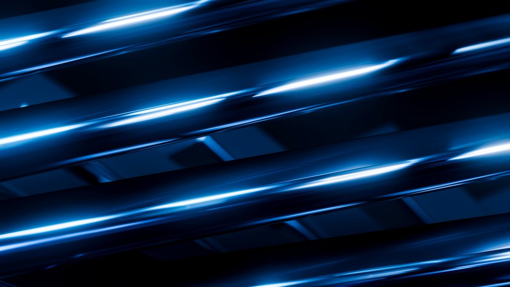 Blue reflective metal tubes arranged in an abstract pattern with illuminated light streaks on a dark background.