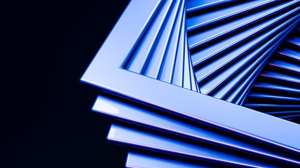 Blue metallic 3D frames stacked in a glossy spiral pattern forming an abstract geometric digital illustration.