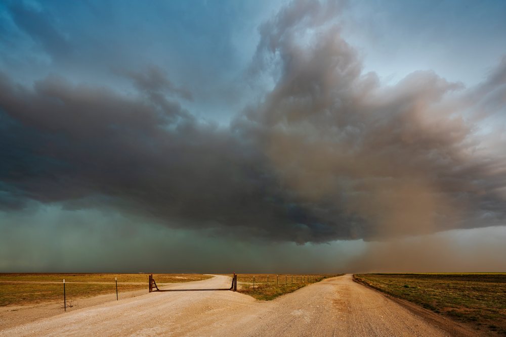 Storm Cell and Dust Cloud move over dirt roads and flat open plains, in the Great Plains region of the, Storm Chasing, Weather, Environment, Dalhart, Texas, USA.