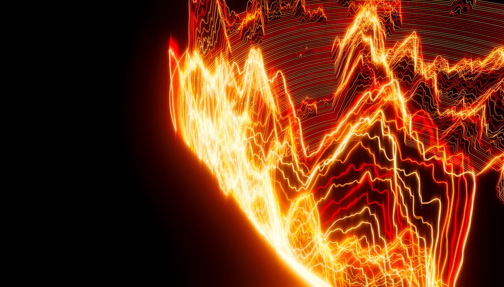 Light trails forming glowing orange and red abstract wave patterns on a black background in a digital visualization.