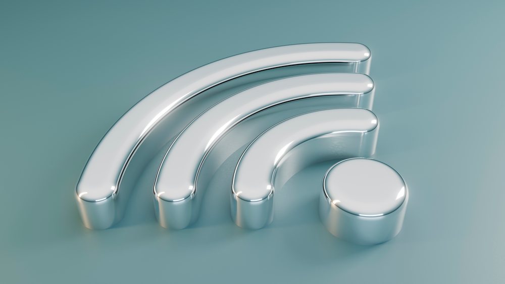 Metallic 3D wifi symbol with reflective chrome finish on a smooth blue surface representing wireless internet technology.