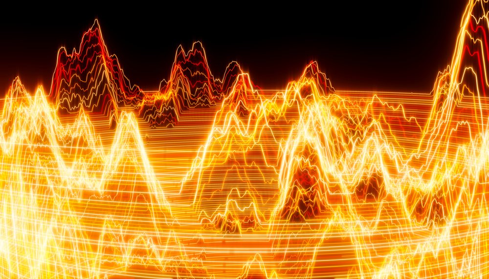 Abstract glowing orange and red waveforms with digital light lines on a black background.