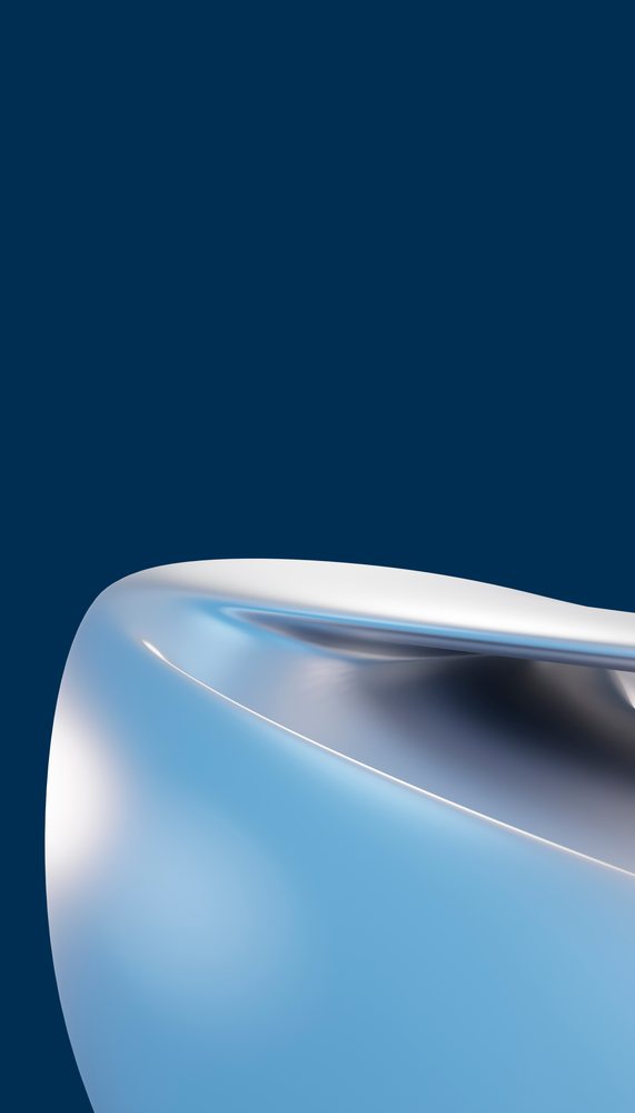 Abstract smooth metallic sculpture with curved surface on blue background.