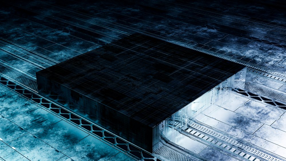 Metallic geometric structure illuminated by blue lighting in a sleek, modern industrial environment.