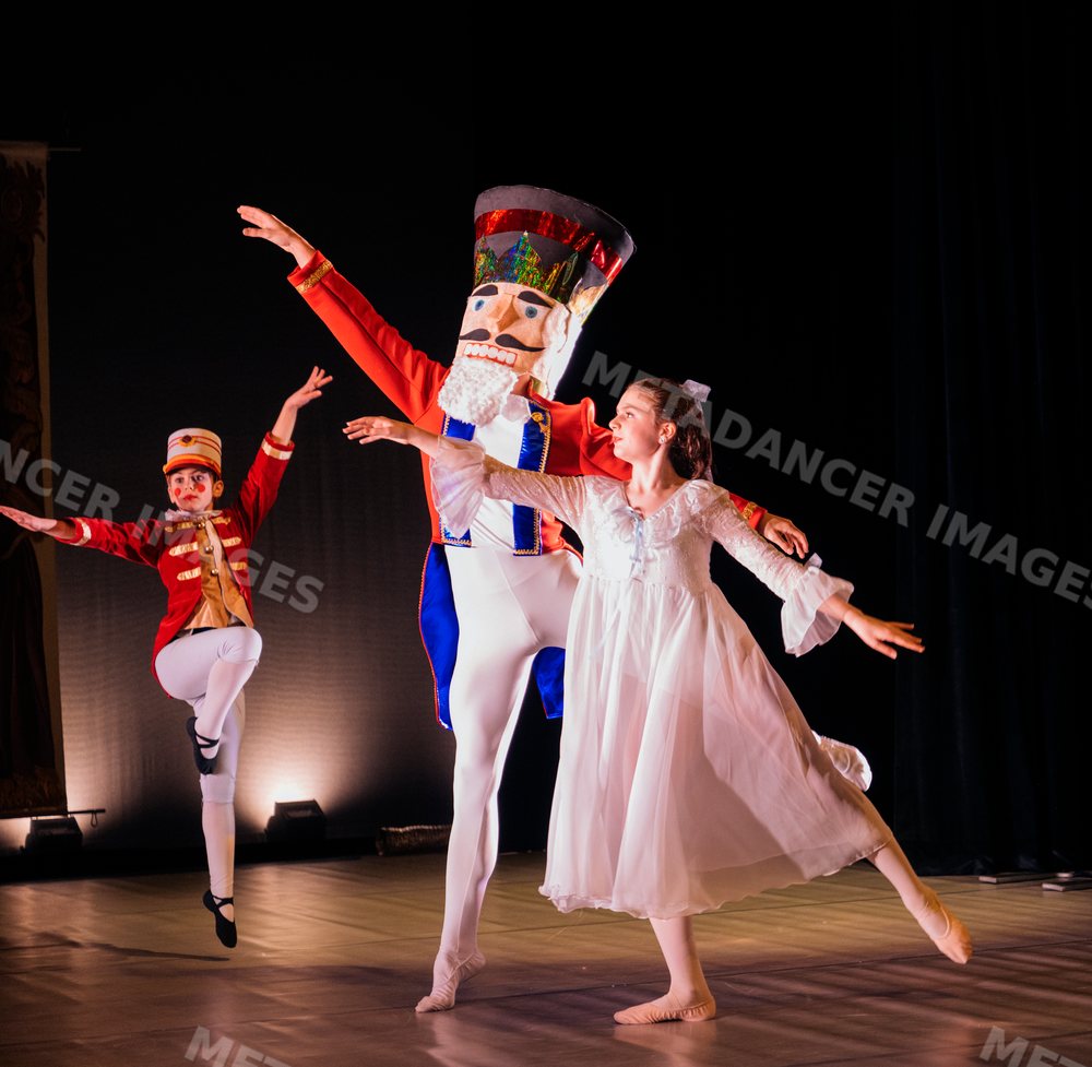Dancers perform a holiday ballet on stage
