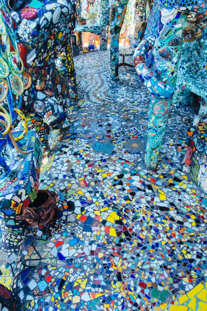 Colorful mosaic art sculpture installation with decorative tiles forming a detailed walkway outdoors, CA, USA.