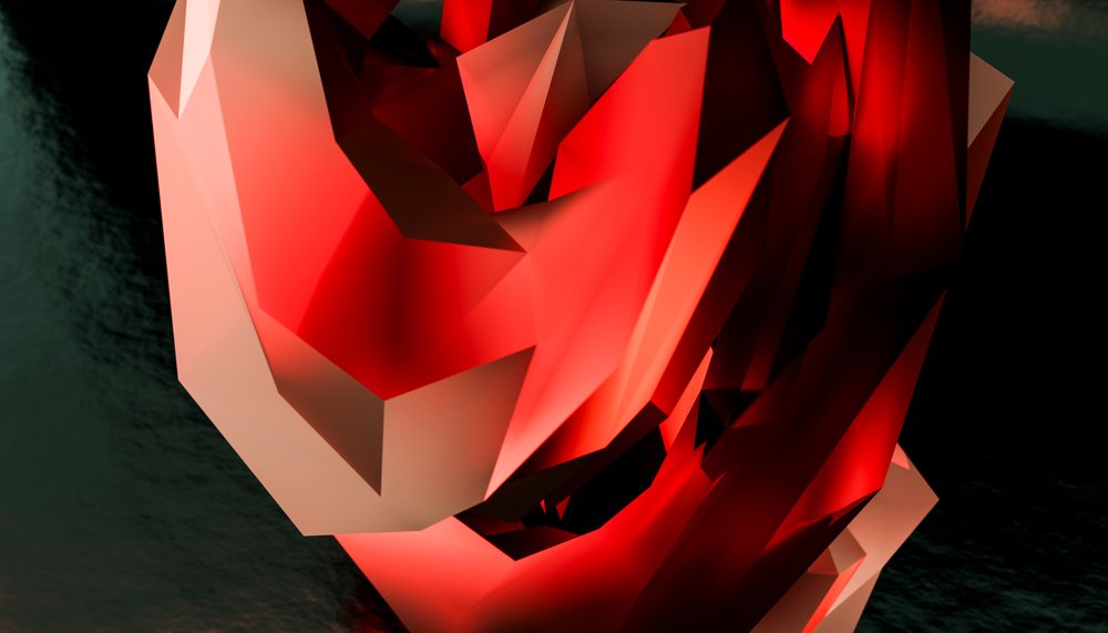 Red polygonal abstract sculpture featuring geometric faceted shapes on a dark background.