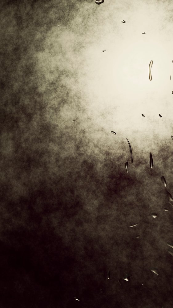 Dark abstract background featuring foggy texture and shiny water droplets reflecting light.