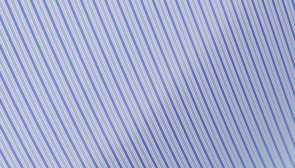 Striped fabric featuring diagonal blue, white, and red lines creating a detailed textile pattern.