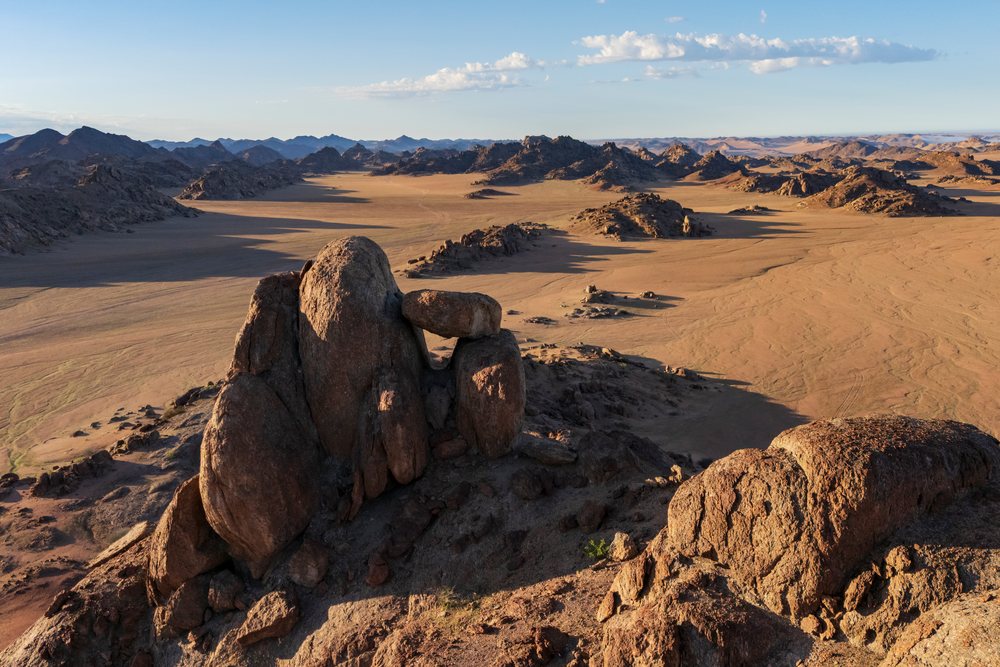 Balanced rock formation overlooking a desert valley, landscape, wildlife, The bear at Rock Gardens, Kunene Region, Namibia.