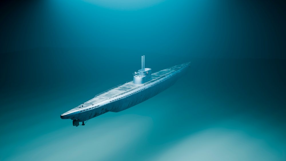 Submarine navigating underwater in the deep ocean.