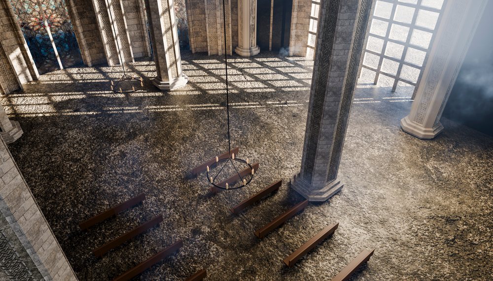 Large ancient hall with stone columns, wooden benches, arched lattice windows, and hanging metal chandeliers casting patterned shadows on the textured stone floor.