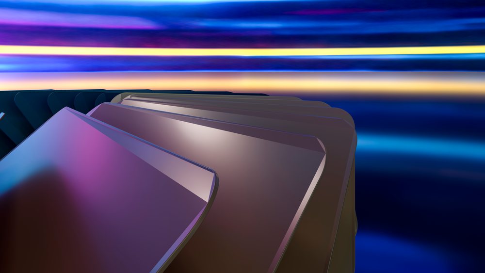 Abstract digital art featuring colorful layered geometric shapes with smooth metallic surfaces on a blue gradient background.