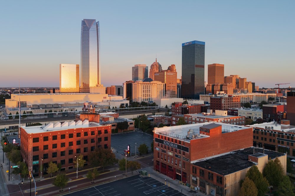 Oklahoma City skyline at Sunrise showing downtown with modern and historic buildings under a clear sky, USA.