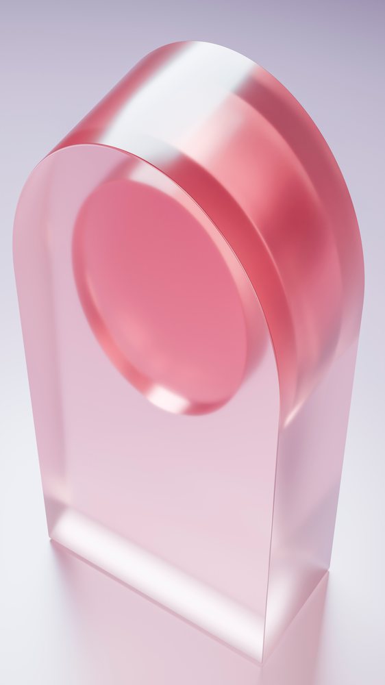 Pink transparent arch-shaped abstract sculpture with a smooth surface and rounded edges on a studio background with soft pastel lighting.