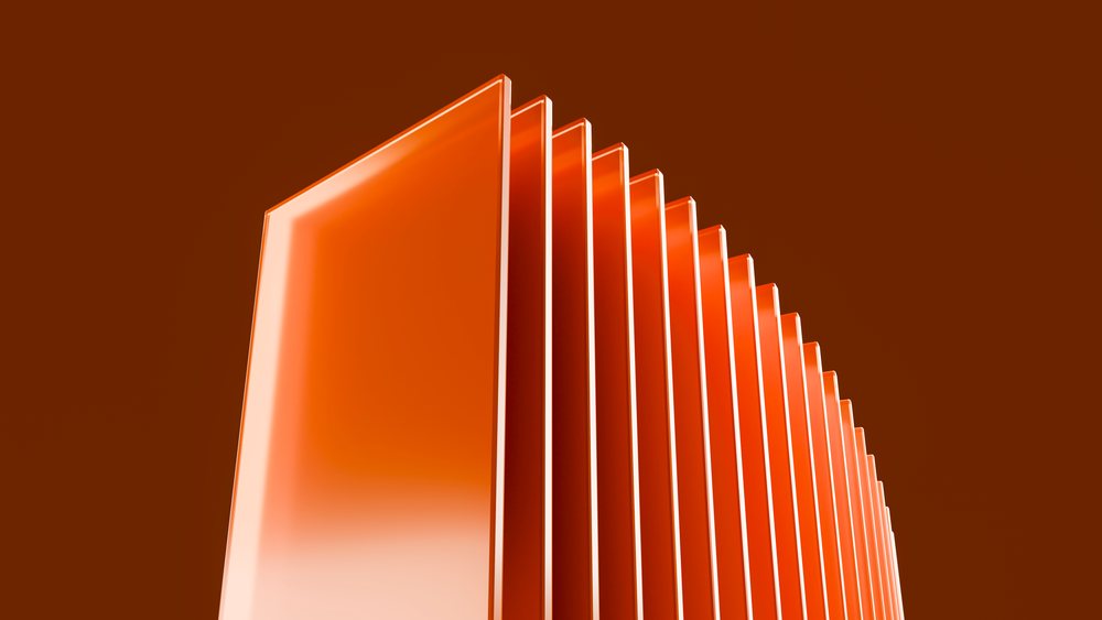 Stacked glossy orange rectangular panels in a modern abstract geometric arrangement against a clean studio background.
