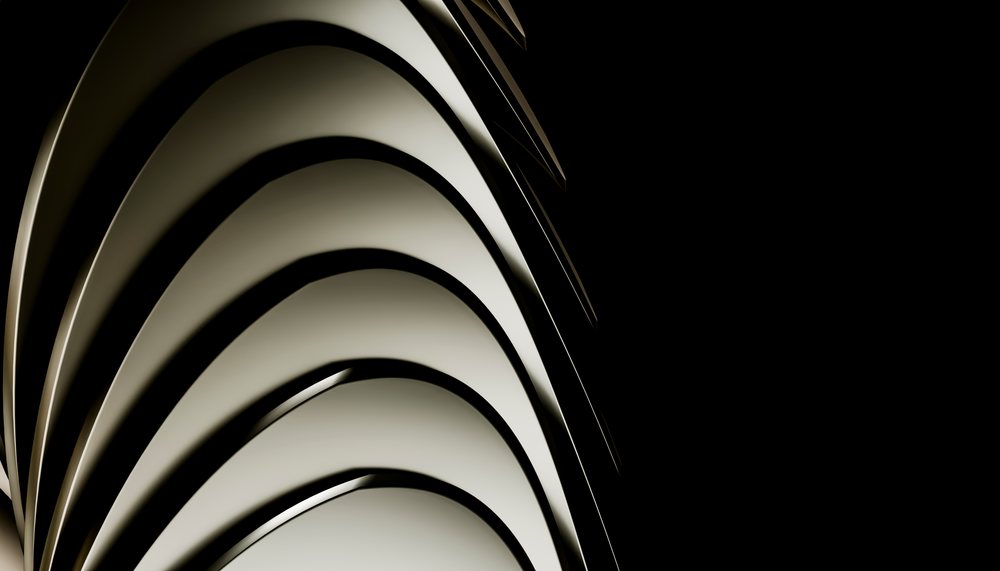 Abstract white curved architectural building facade with repetitive layers on a black background.