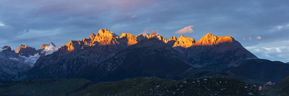 Zhuqing Wujian Zen Forest Monastery at Sunrise with mountain range and alpenglow, Sichuan Province, People's Republic of China.