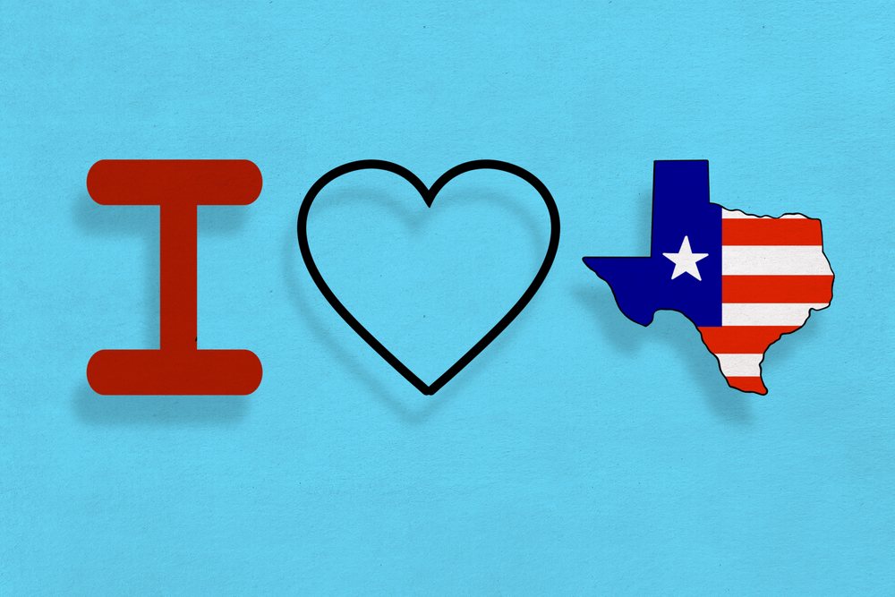 Illustration of the phrase expressing love for a U.S. state using a red letter I, a heart outline, and the state's shape decorated with a flag pattern on a blue background.