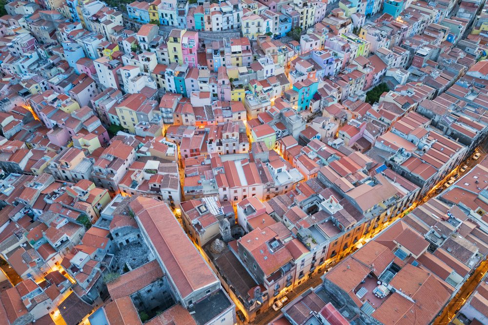 Aerial view of colorful rooftops and residential buildings, Travel Images, Bosa, Sardinia, Italy.