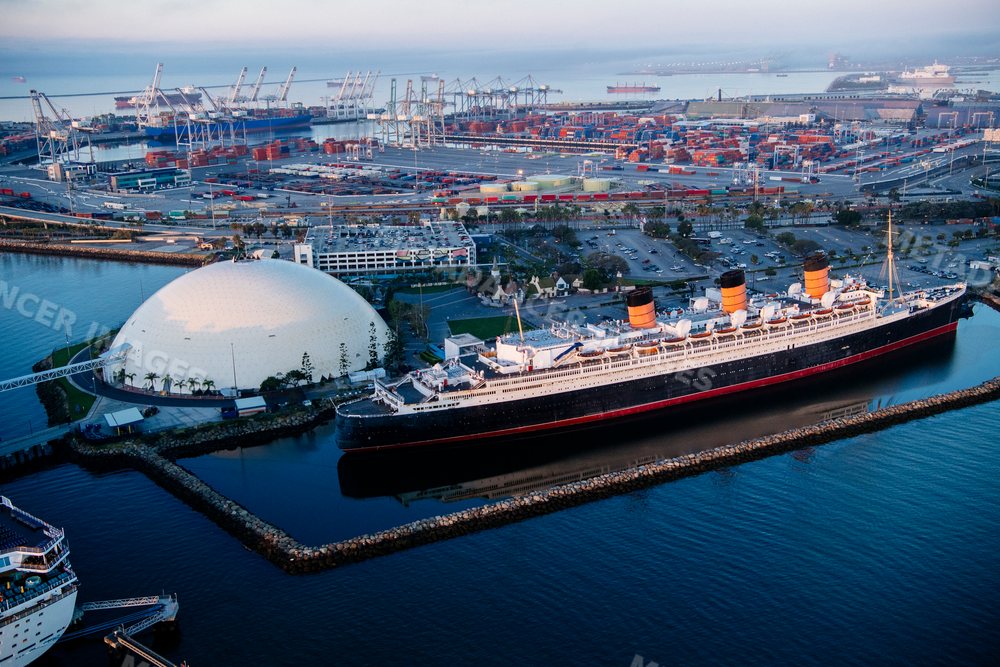 Historic ocean liner docked at the busy port of Long Beach, CA, USA