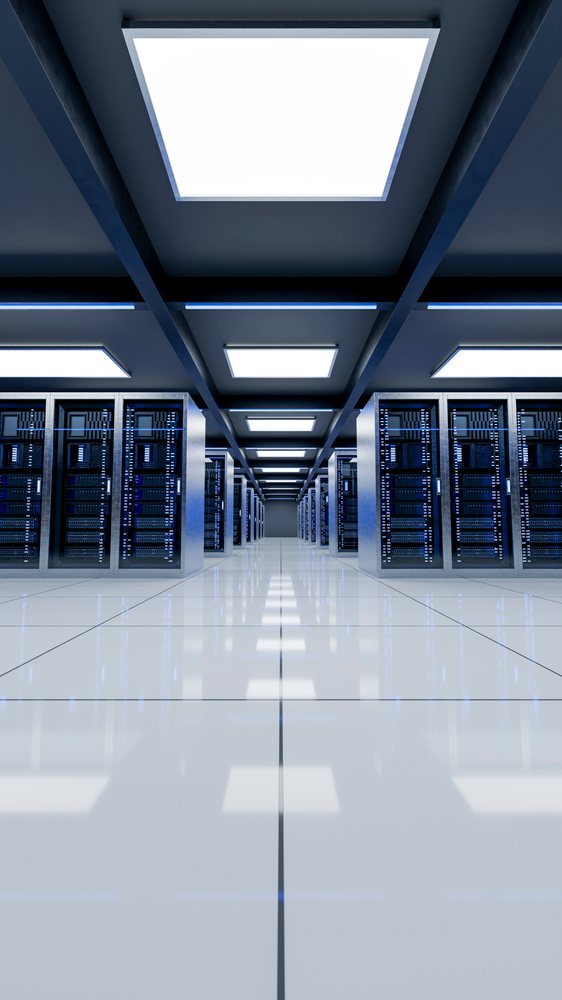 Computer server racks arranged in rows inside a modern data center.
