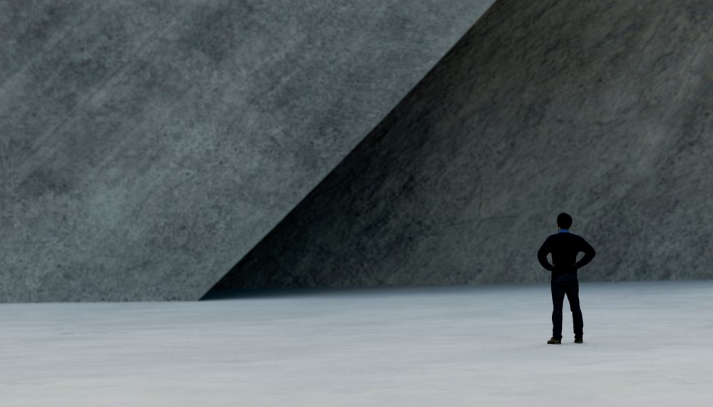 A man stands contemplatively