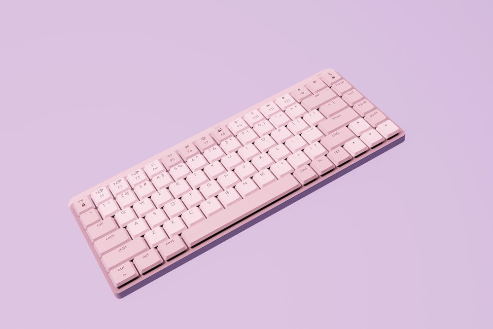Wireless computer keyboard with pink keys on a pink background featuring a clean minimalist design, abstract render background.