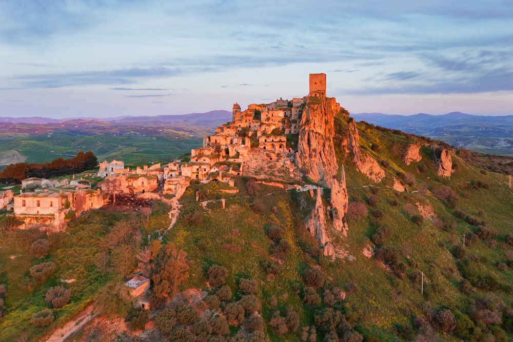 Ruined city of Craco on a hilltop at Sunrise, Basilicata, Italy.