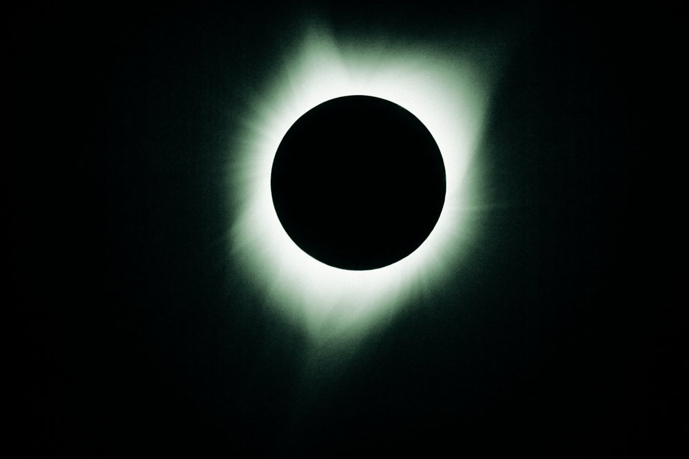 Total solar eclipse in Los Angeles showing the sun's glowing corona around the dark moon, USA.