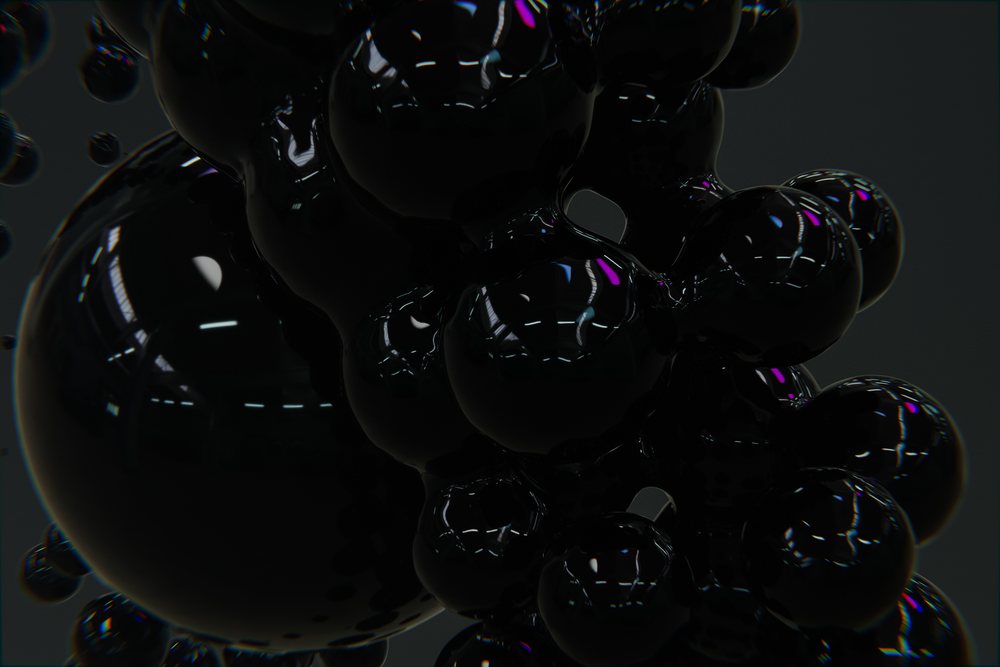 Cluster of glossy black spheres with reflective surfaces forming an abstract 3D composition on a dark background.