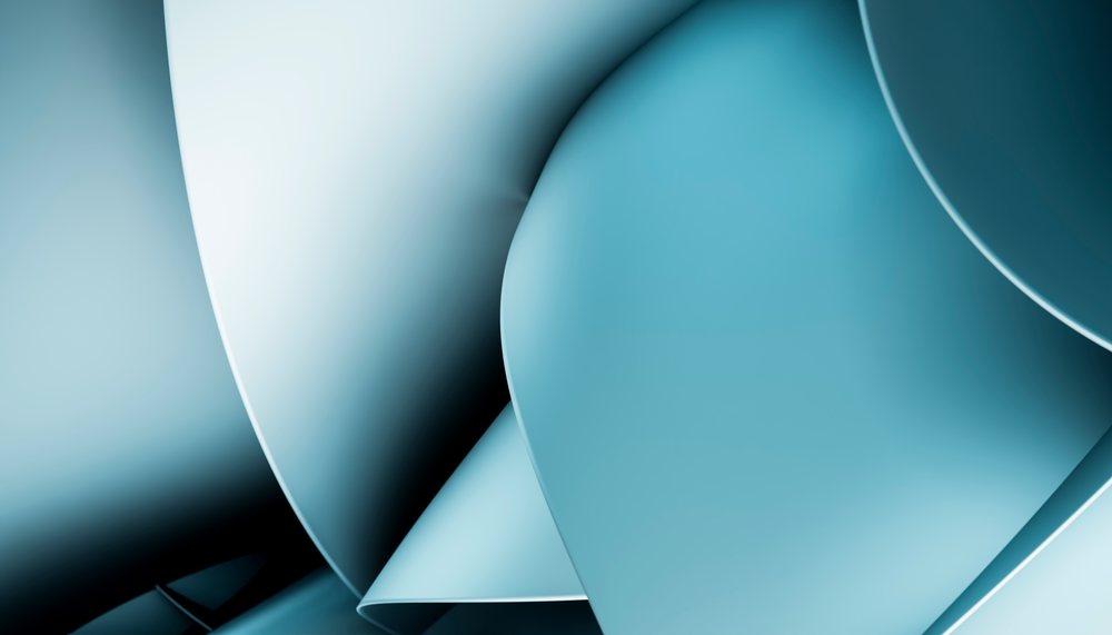 Abstract blue curved shapes overlapping to create a smooth, modern digital design.