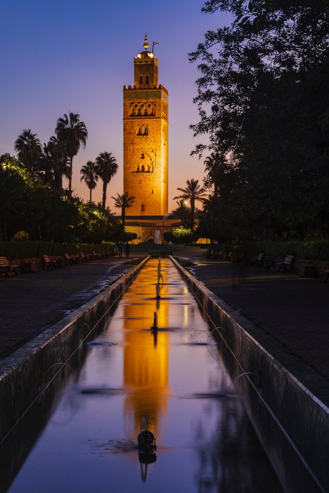 Koutoubia Minaret reflected in a garden fountain at Dawn, Lifestyle, Landscape, Culture, Marrakech, Marrakesh-Safi Region, Morocco.