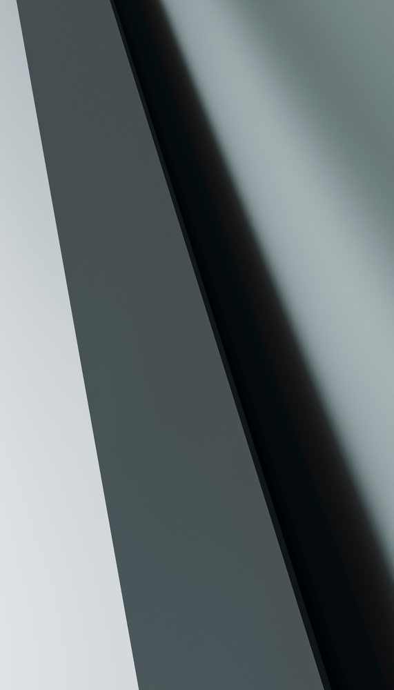 Close-up of a black shiny surface with diagonal shadows and reflections forming an abstract geometric pattern.
