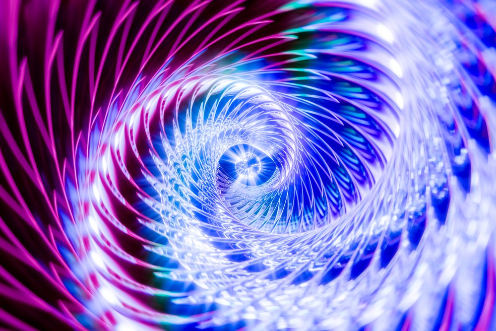 abstract colorful spiral light pattern with bright blue and pink reflections.
