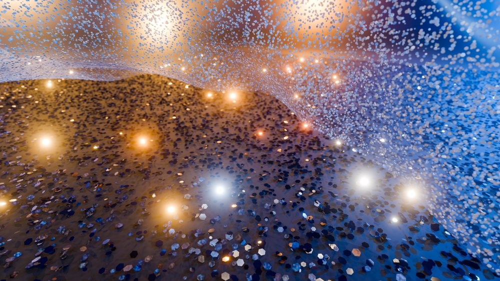 Digital illustration showing glowing blue and orange particles forming a dynamic wave shape with sparkles and gradient colors.